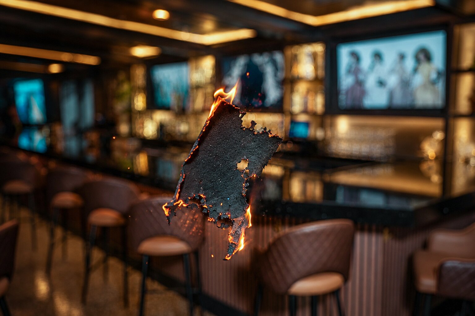 The Fuego bar aglow with warm light and signature fire branding