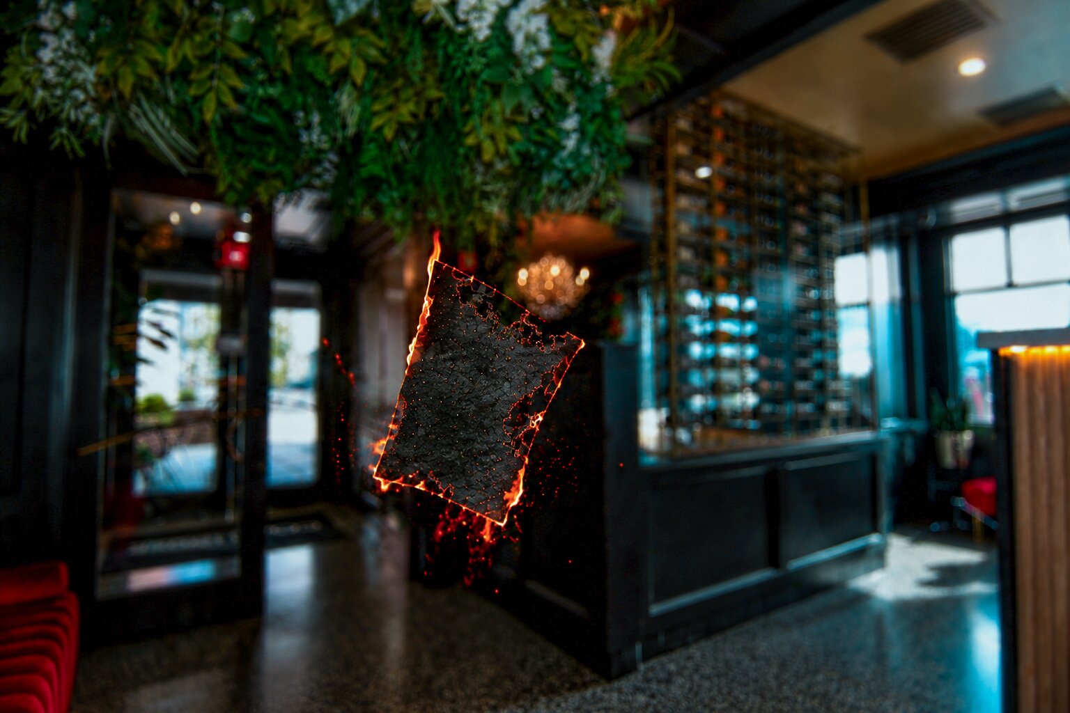 The floral entrance and wine display at Fuego Steakhouse & Bar