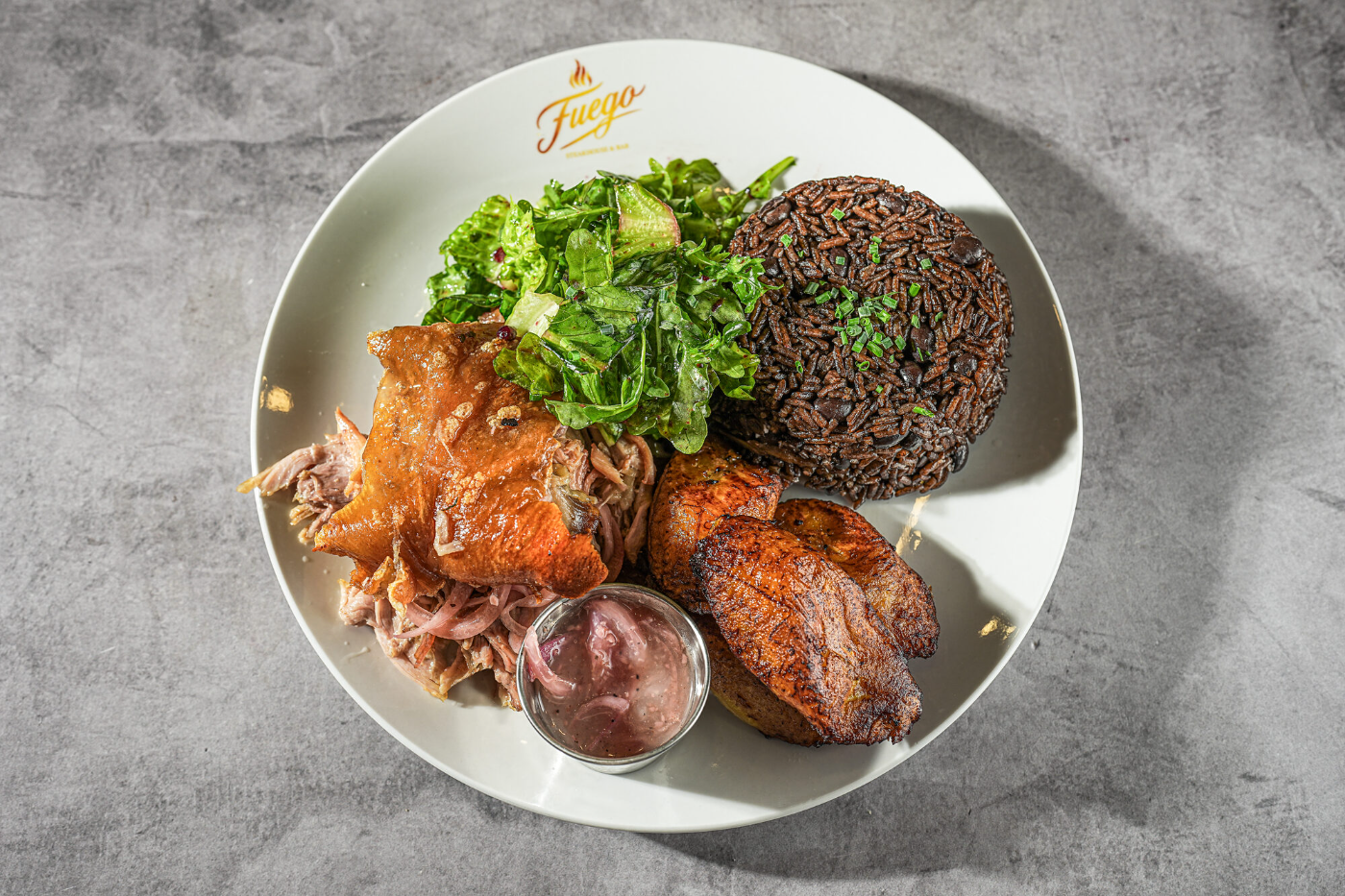 Grilled salmon with morcilla, sausage and greens