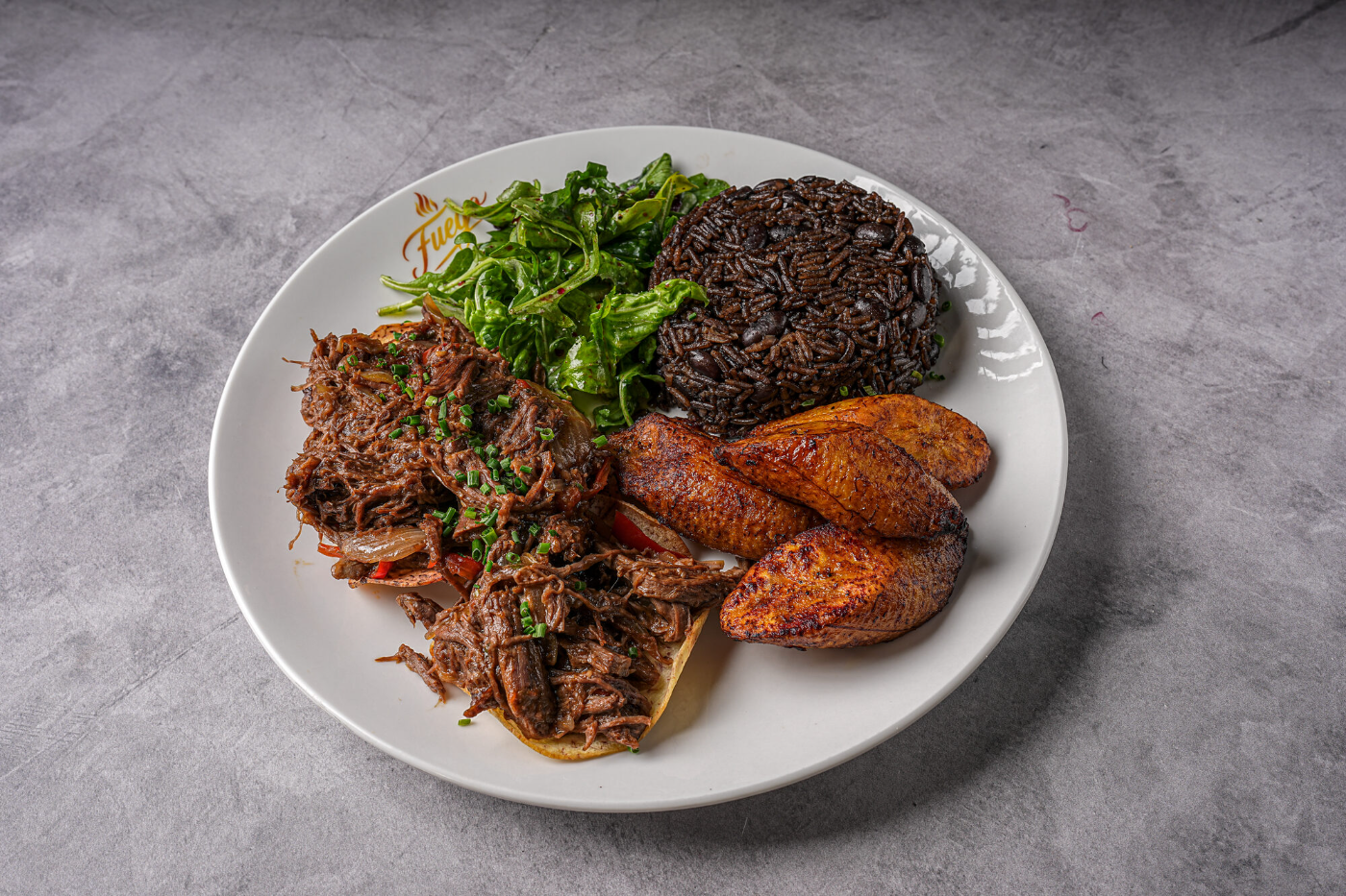 Braised short rib with sweet plantains and fresh greens