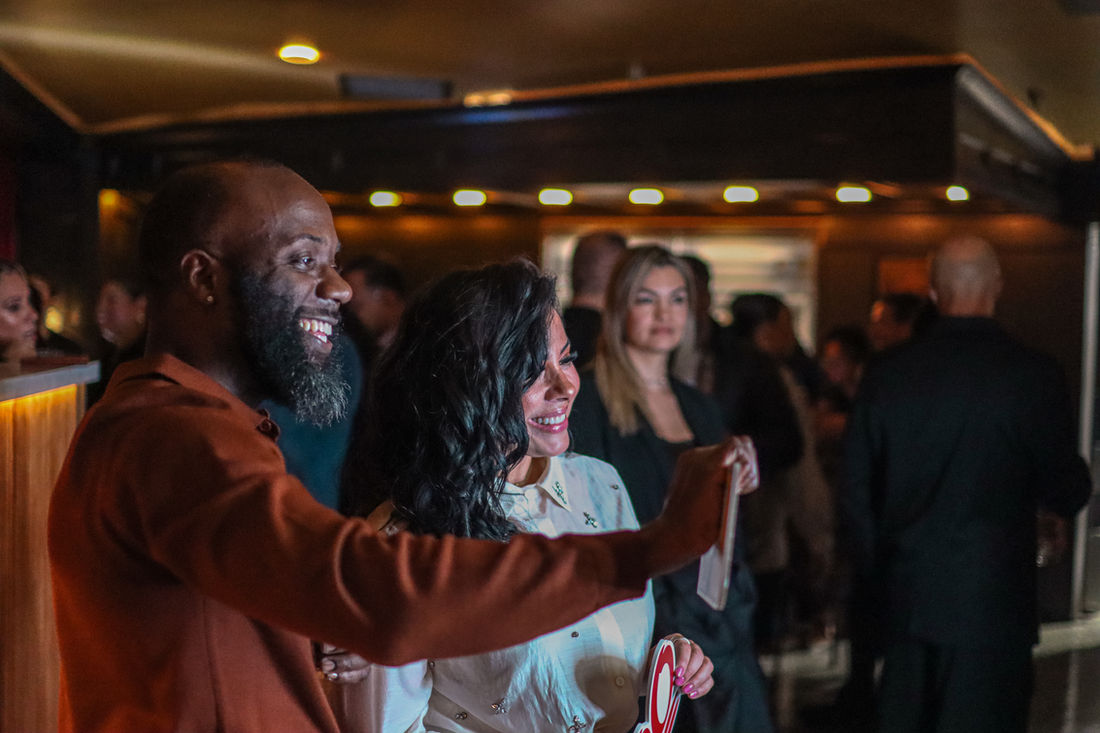 Guests posing together at a Fuego Steakhouse & Bar event