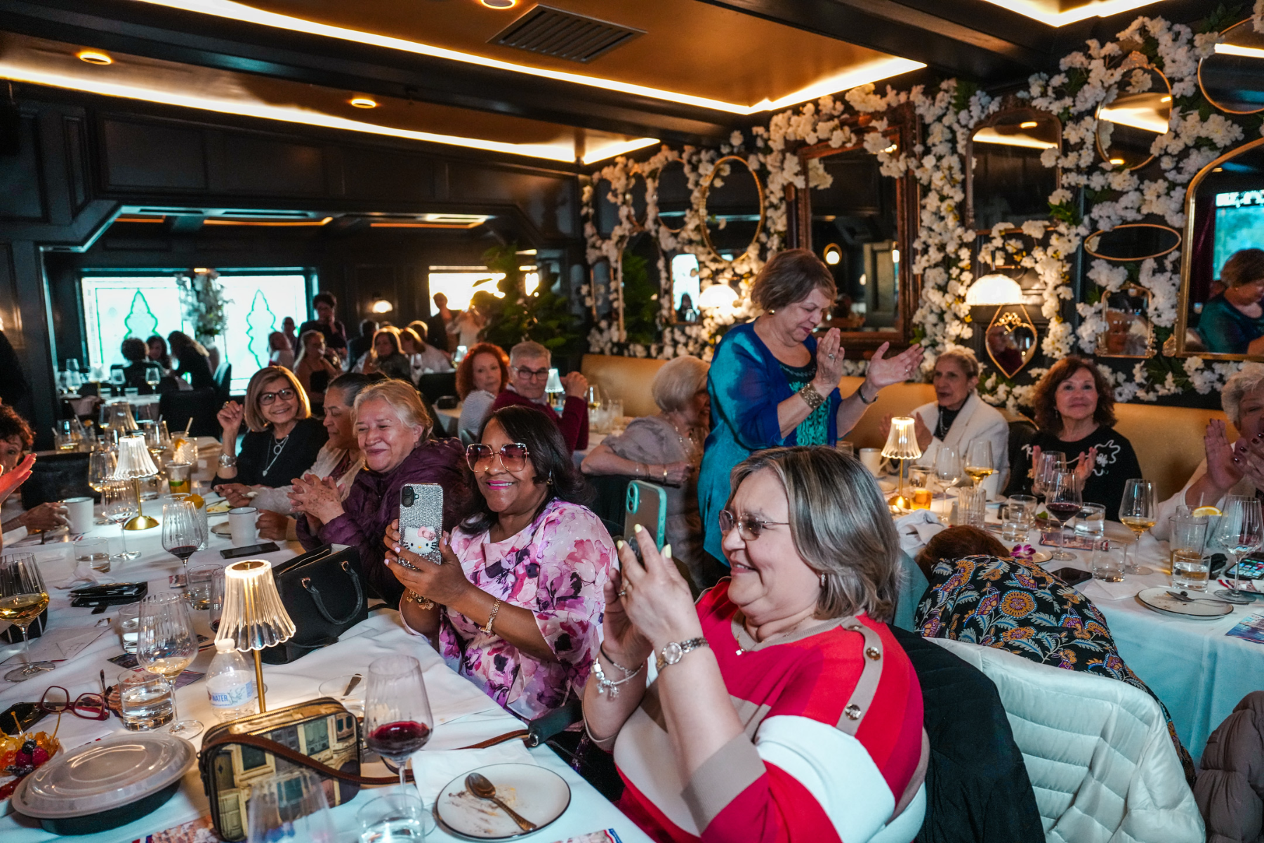 A full dining room of families and guests celebrating together at Fuego Steakhouse & Bar